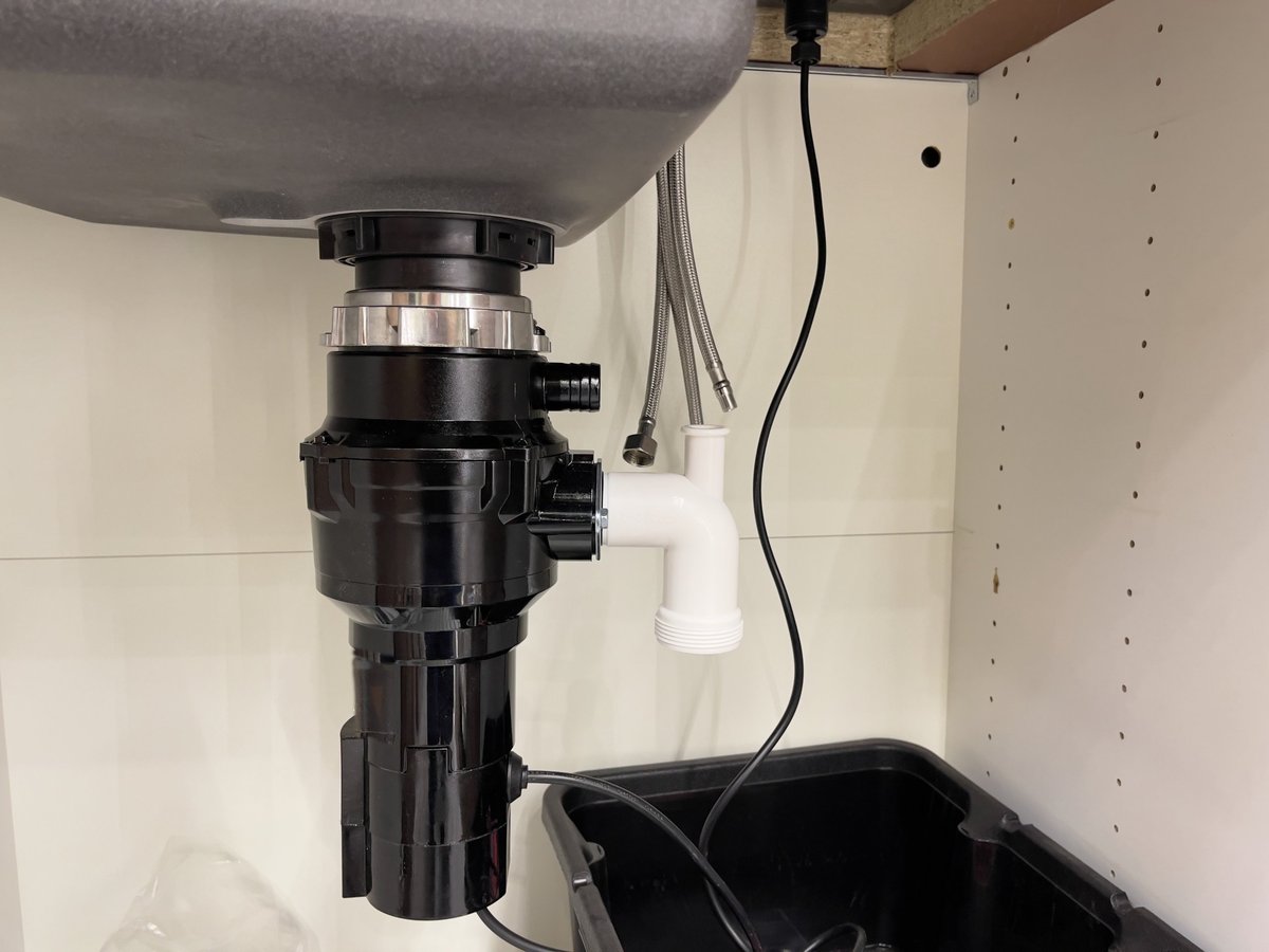 Kitchen sink interior and food waste shredder in a modern kitchen